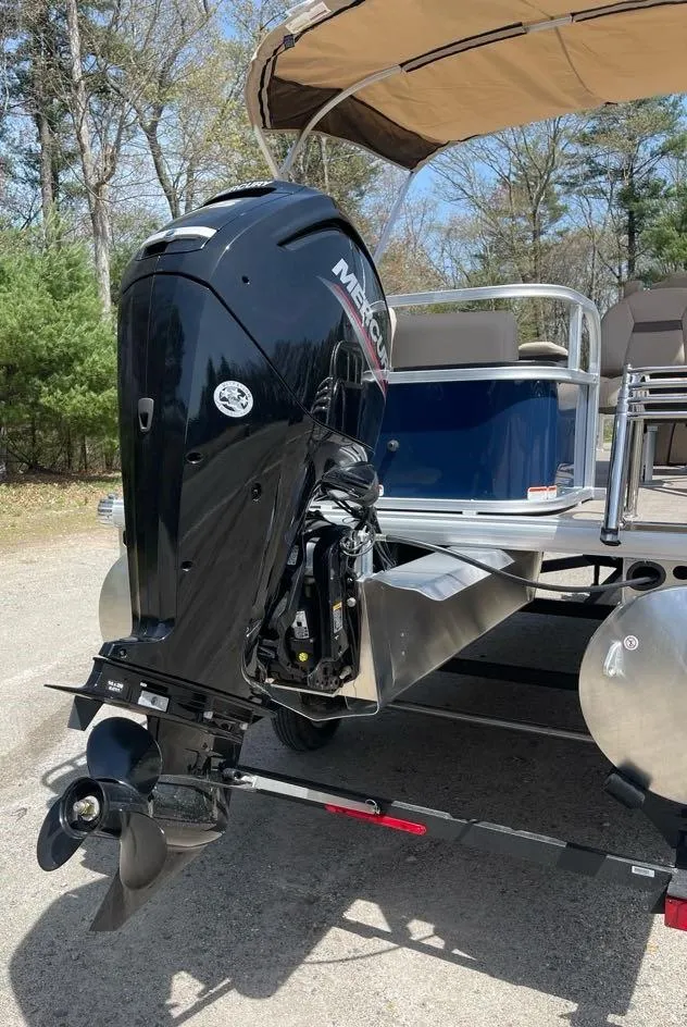 Slide: The Image of 2025 Sun Tracker Bass Buggy 18 DLX pontoon boat with Mercury outboard motor. - 5