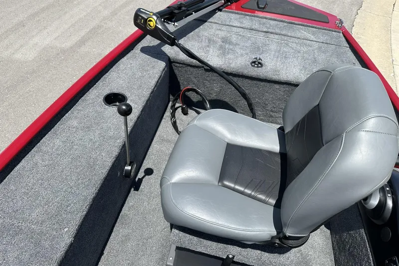 Slide: The Image of 2025 Tracker Panfish 17 boat interior with gray seating and steering controls. - 9