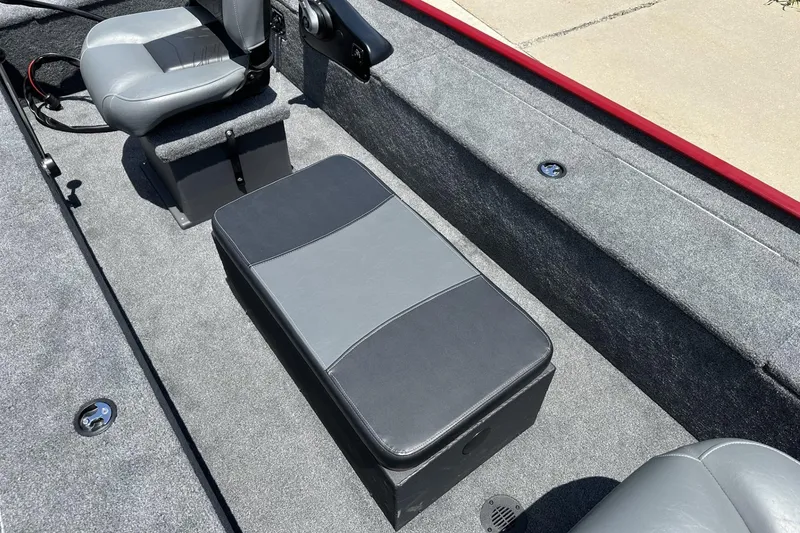 Slide: The Image of 2025 Tracker Panfish 17 boat interior with gray seating and storage compartment. - 11