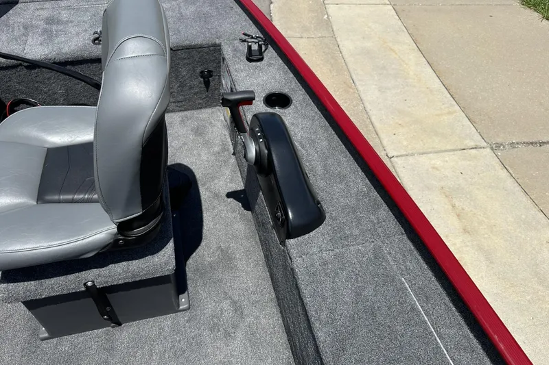 Slide: The Image of 2025 Tracker Panfish 17 boat interior with gray seating and control panel. - 10