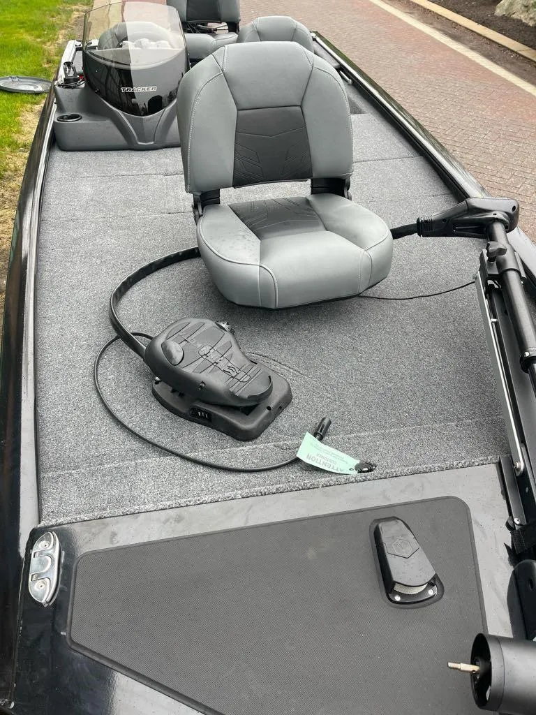 Slide: The Image of 2025 Tracker Pro 170 boat interior with gray seating and control panel. - 4