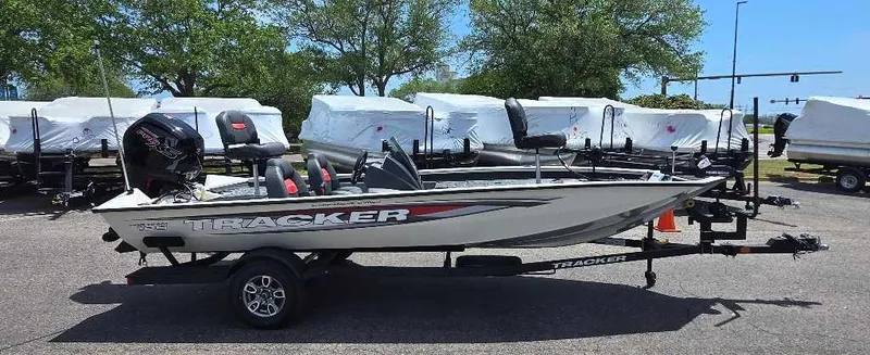 Slide: The Image of 2025 Tracker Pro Team 190 boat on trailer, parked outdoors. - 3
