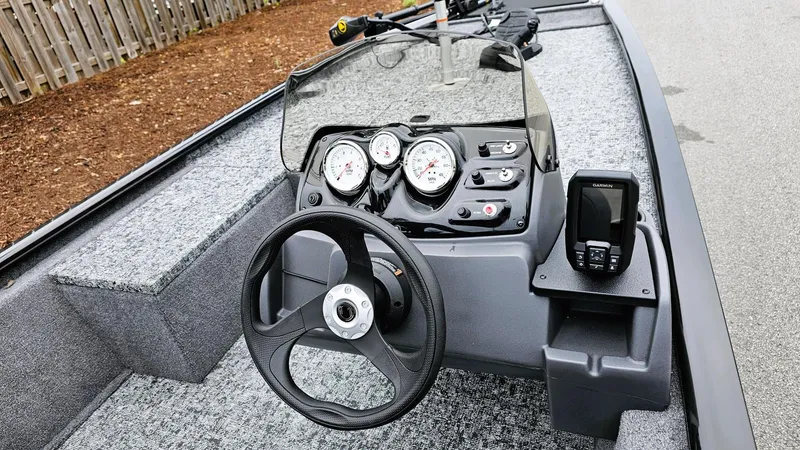 Slide: The Image of 2025 Tracker Pro 170 boat dashboard with steering wheel and gauges. - 5