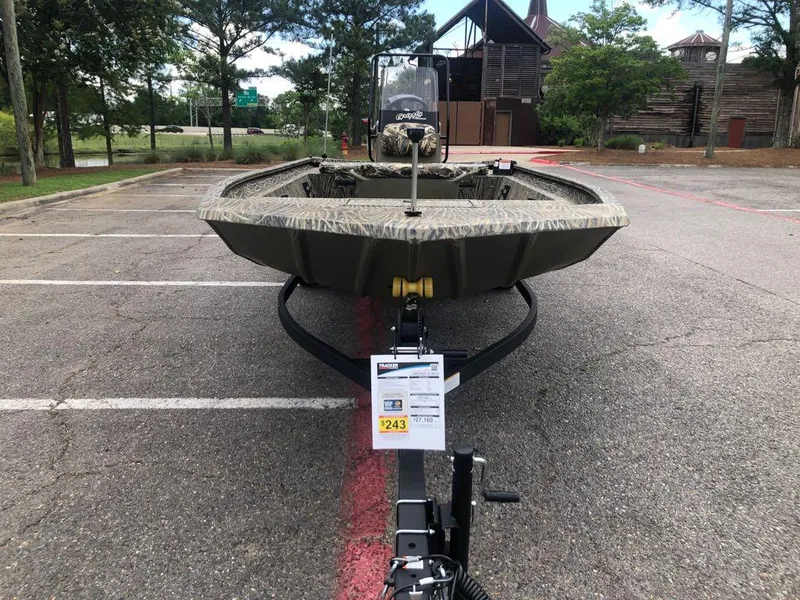 Slide: The Image of 2025 Tracker Grizzly 1860 CC boat on trailer in parking lot. - 7