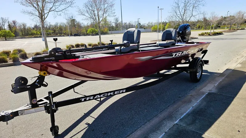 Slide: The Image of 2025 Tracker Panfish 17 boat on trailer in parking lot. - 5
