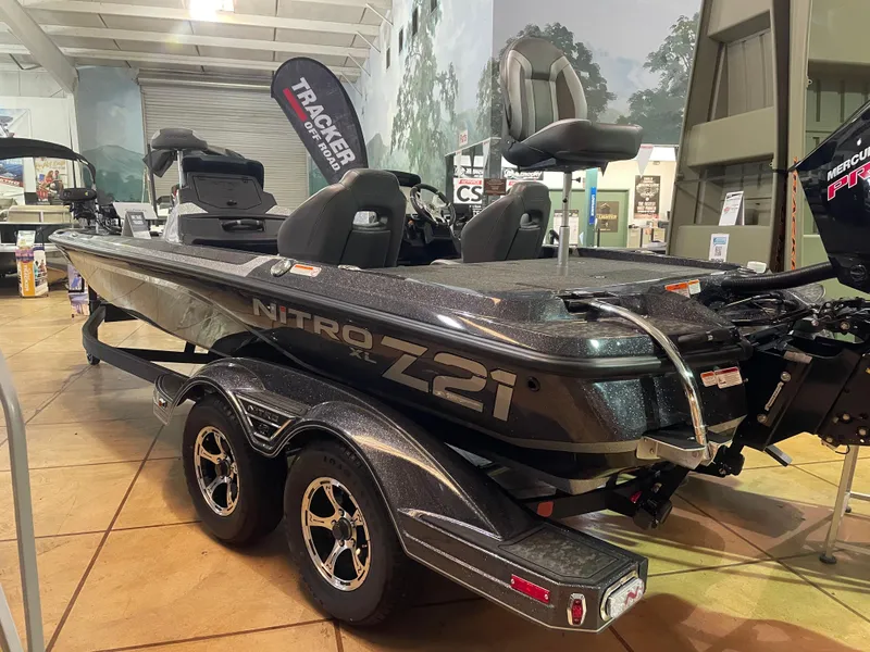 Slide: The Image of 2025 Nitro Z21 XL Pro boat displayed indoors on a trailer. - 0