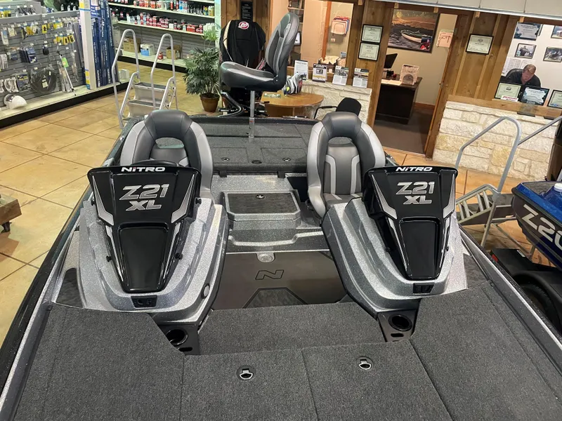 Slide: The Image of 2025 Nitro Z21 XL Pro boat interior with dual seats and sleek design. - 13