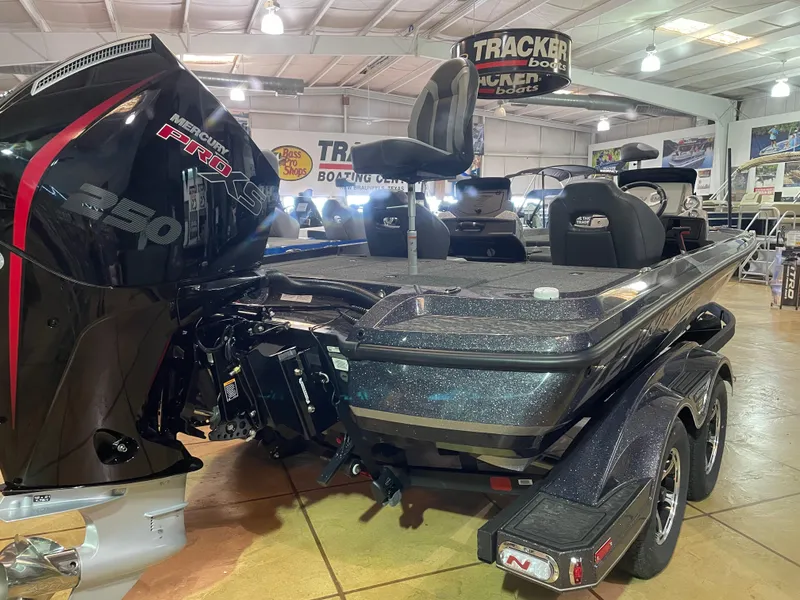 Slide: The Image of 2025 Nitro Z21 XL Pro boat in showroom, featuring powerful engine and sleek design. - 2