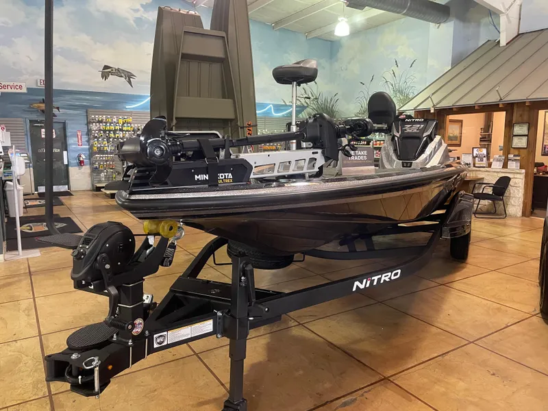 Slide: The Image of 2025 Nitro Z21 XL Pro boat displayed indoors on a trailer. - 5
