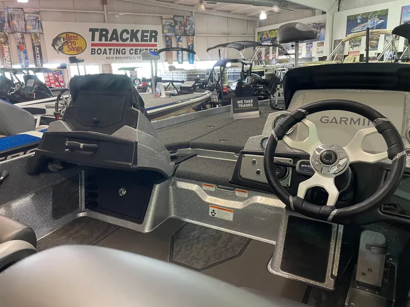 Slide: The Image of 2025 Nitro Z21 XL Pro boat interior with Garmin steering, displayed at Tracker Boating Center. - 9