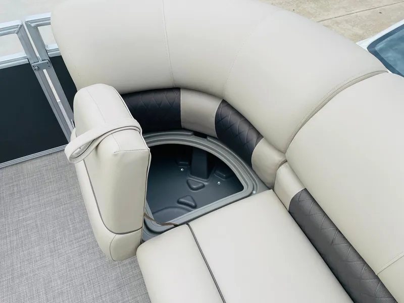 Slide: The Image of 2025 Sun Tracker Party Barge 20 DLX seating with storage compartment open. - 17