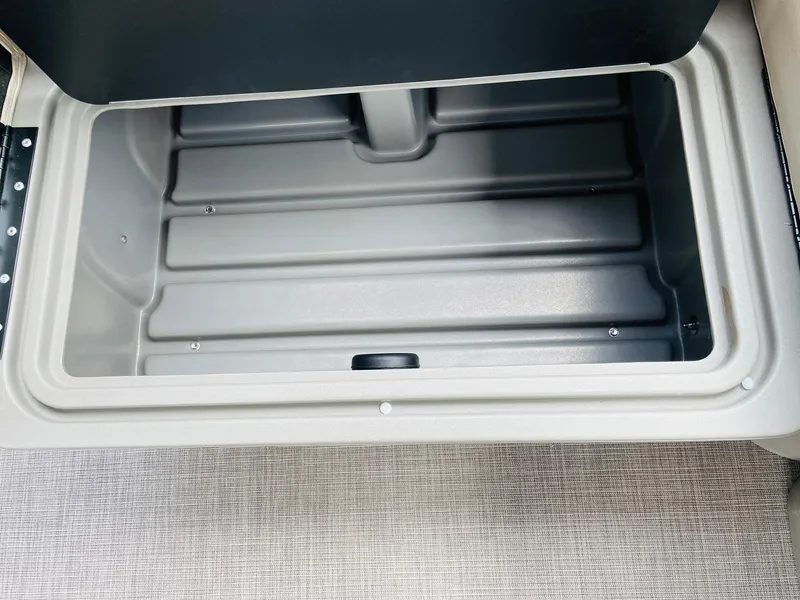 Slide: The Image of Storage compartment of 2025 Sun Tracker Party Barge 20 DLX, featuring spacious interior. - 30