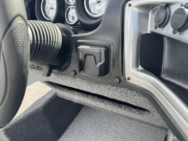 Slide: The Image of 2024 Lund 1775 Impact XS Sport dashboard with gauges and controls. - 15