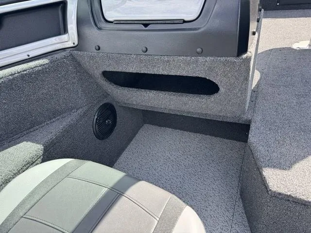 Slide: The Image of 2024 Lund 1775 Impact XS Sport interior, featuring seating and storage compartments. - 18