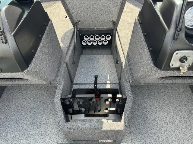 Slide: The Image of 2024 Lund 1775 Impact XS Sport boat interior with rod storage compartment. - 22