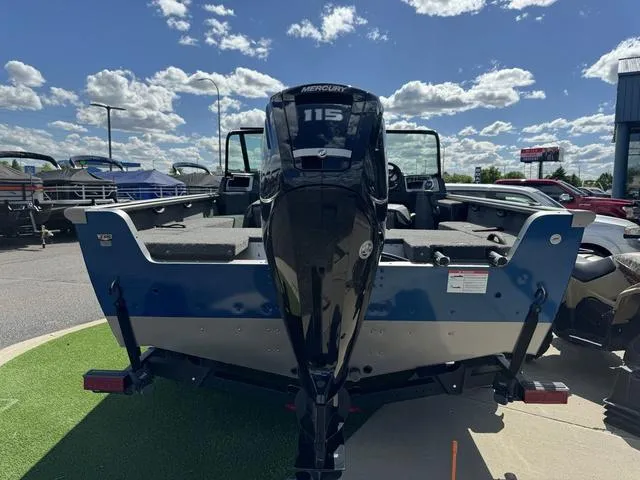 Slide: The Image of 2024 Lund 1775 Impact XS Sport boat with Mercury 115 engine, parked outdoors. - 5