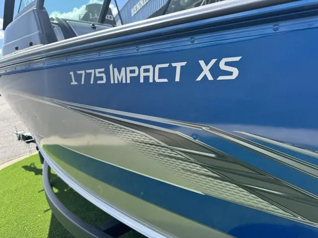 Slide: The Image of 2024 Lund 1775 Impact XS Sport boat, blue exterior, close-up view. - 6