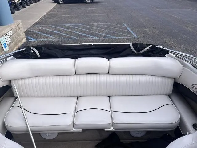 Slide: The Image of 2013 Crownline 18 SS boat interior with white seating and black accents. - 10