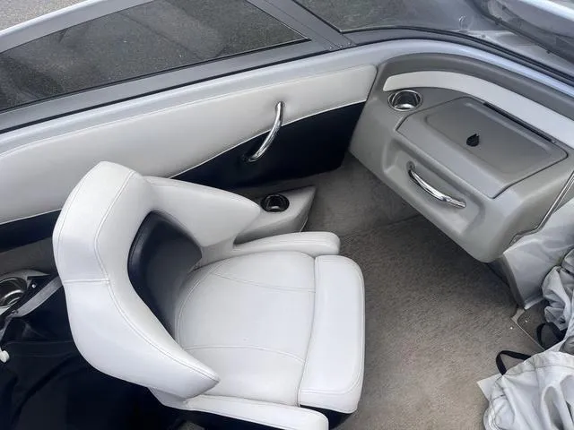 Slide: The Image of 2013 Crownline 18 SS boat interior with white seating and sleek design. - 14