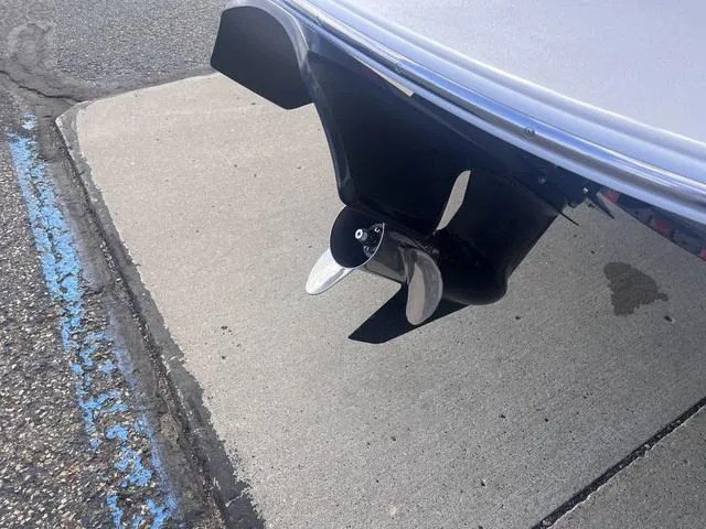 Slide: The Image of Propeller of a 2013 Crownline 18 SS boat on pavement. - 18