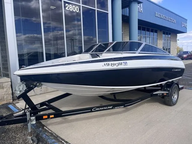 Slide: The Image of 2013 Crownline 18 SS boat on trailer outside dealership. - 2