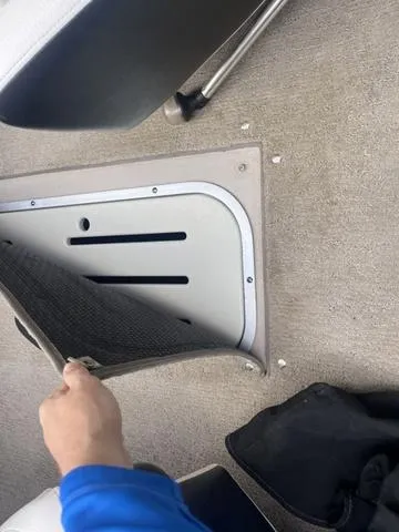 Slide: The Image of 2013 Crownline 18 SS boat interior with carpet and storage compartment. - 28