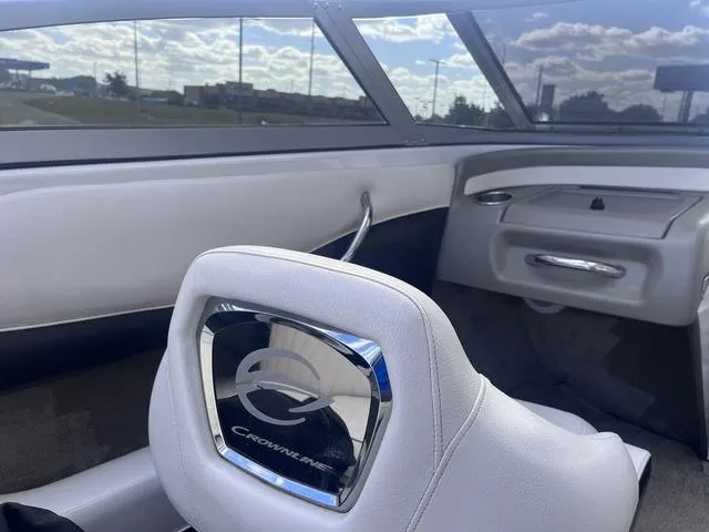 Slide: The Image of 2013 Crownline 18 SS boat interior with logo on seat, showcasing sleek design. - 31