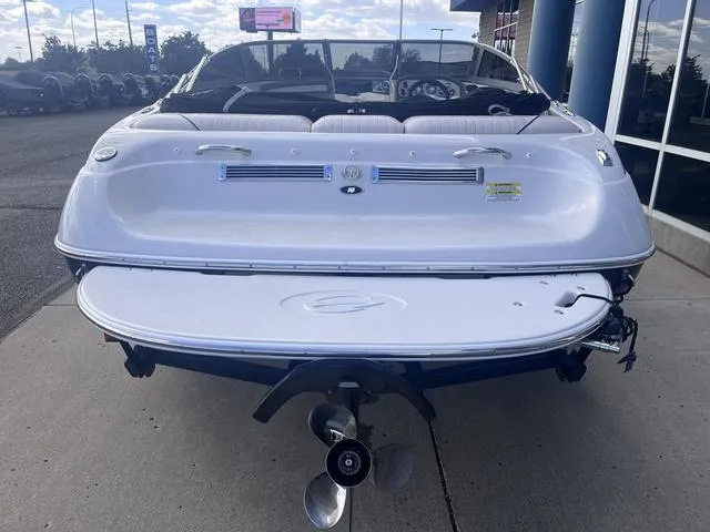 Slide: The Image of 2013 Crownline 18 SS boat, rear view, showcasing swim platform and propeller. - 4