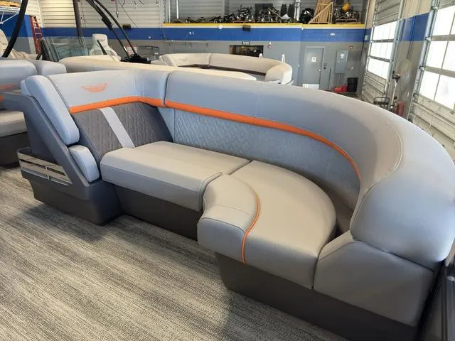 Slide: The Image of 2025 Bennington 22ML Cruise boat interior with modern gray and orange seating. - 10