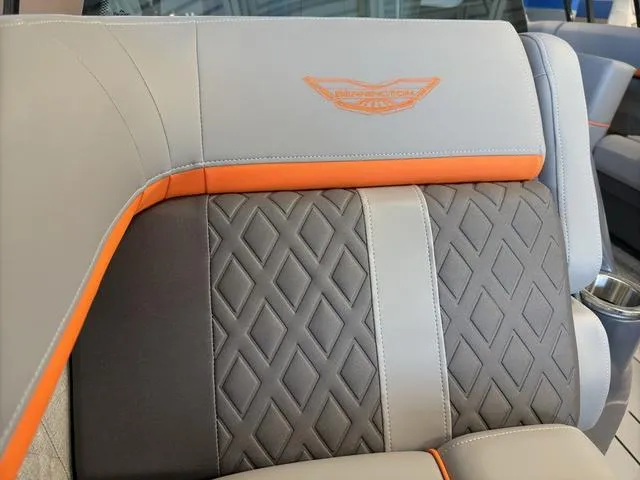 Slide: The Image of 2025 Bennington 22ML Cruise boat seat with diamond pattern and orange accents. - 14