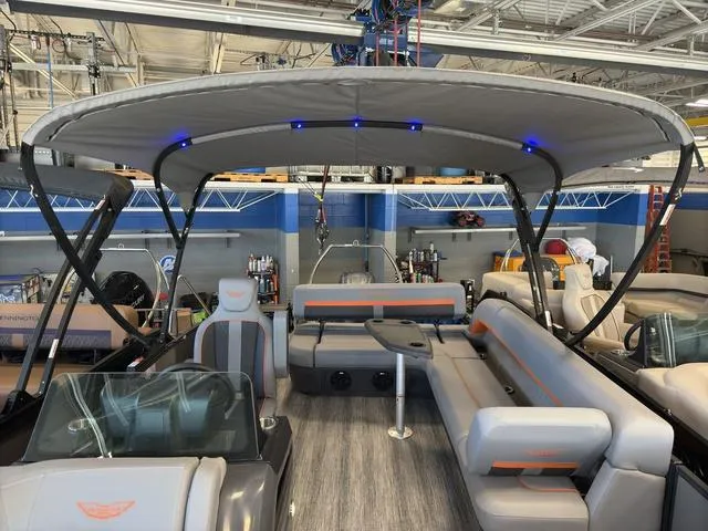 Slide: The Image of 2025 Bennington 22ML Cruise pontoon boat with spacious seating and modern design. - 23