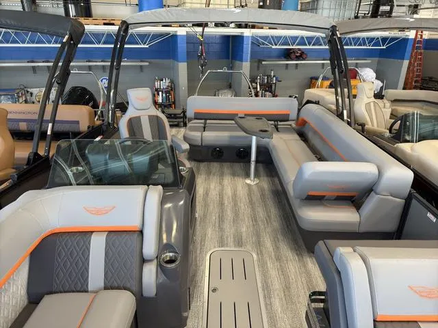 Slide: The Image of 2025 Bennington 22ML Cruise pontoon boat interior with modern seating and sleek design. - 25
