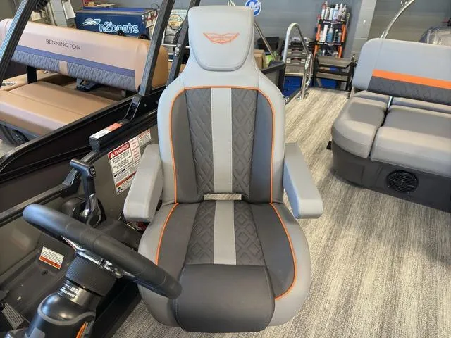 Slide: The Image of 2025 Bennington 22ML Cruise boat interior with stylish captain's chair and seating area. - 29