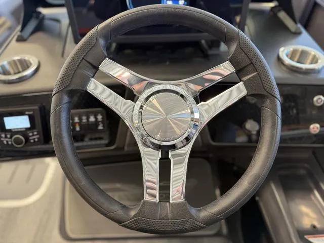 Slide: The Image of Steering wheel of 2025 Bennington 22ML Cruise boat, featuring sleek design and modern controls. - 34