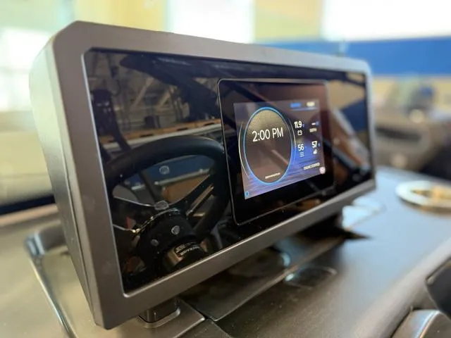 Slide: The Image of Digital dashboard of 2025 Bennington 22ML Cruise boat, displaying time and navigation details. - 36