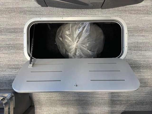 Slide: The Image of Storage compartment on 2025 Bennington 22ML Cruise boat, featuring a sleek, modern design. - 39