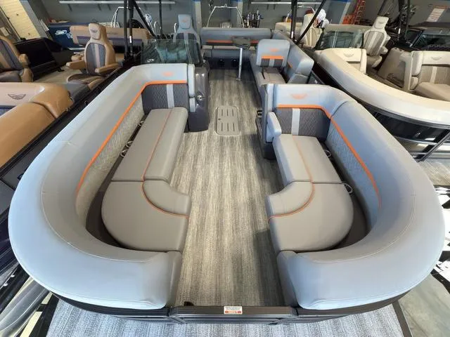Slide: The Image of 2025 Bennington 22ML Cruise pontoon boat with spacious seating and modern interior design. - 4