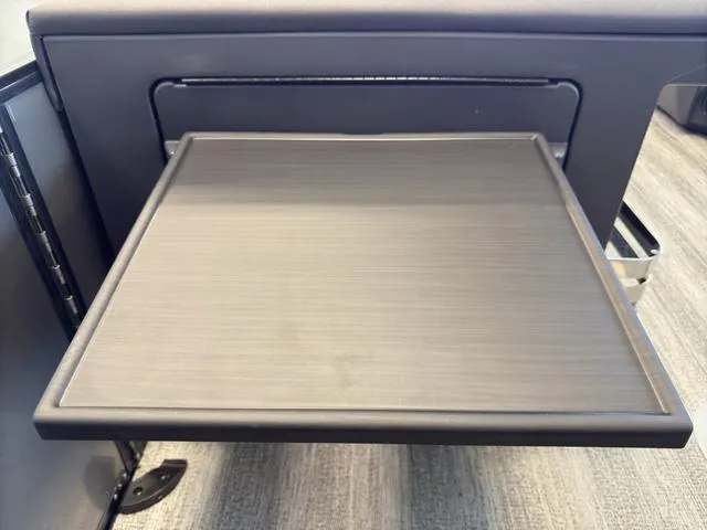 Slide: The Image of Pull-out table on 2025 Bennington 22ML Cruise boat, showcasing sleek design and functionality. - 45