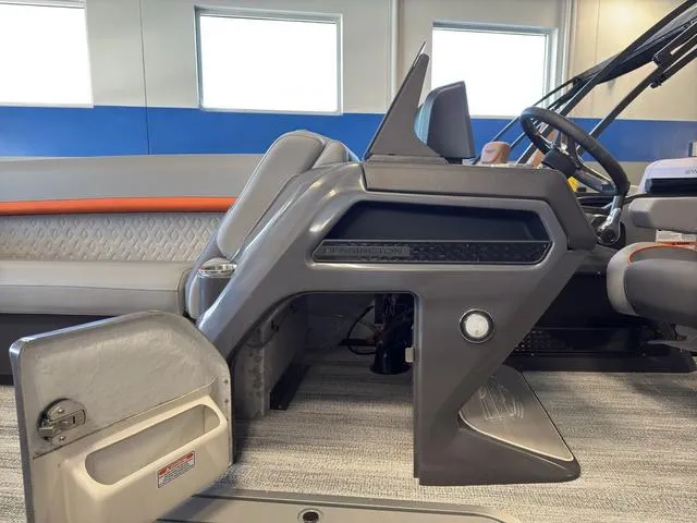 Slide: The Image of Interior of 2025 Bennington 22ML Cruise boat, featuring modern helm and seating. - 47