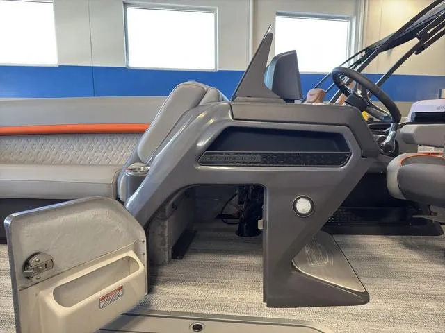 Slide: The Image of 2025 Bennington 22ML Cruise boat interior with modern helm and seating. - 48