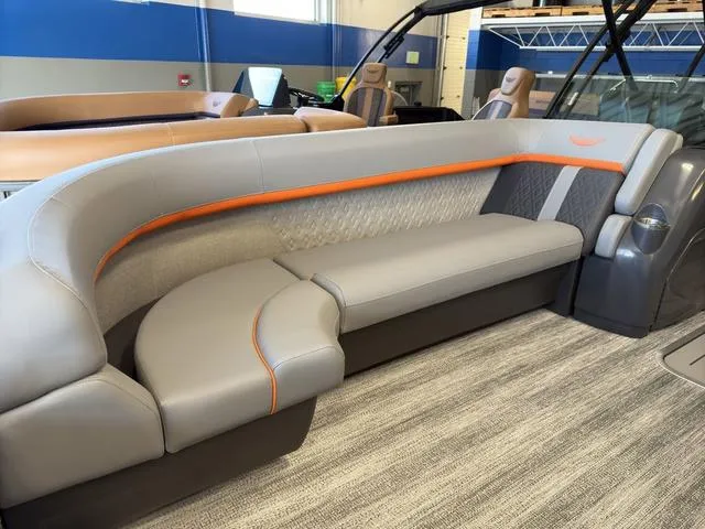Slide: The Image of 2025 Bennington 22ML Cruise boat interior with stylish gray and orange seating. - 8