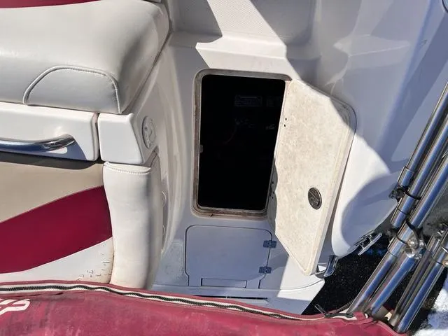 Slide: The Image of Open storage compartment on a 2005 Hurricane FUNDECK202 boat. - 13