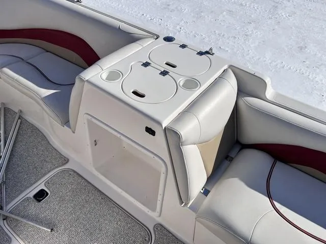 Slide: The Image of 2005 Hurricane FUNDECK202 boat interior with white seating and storage compartments. - 14