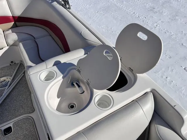 Slide: The Image of 2005 Hurricane FUNDECK202 boat interior with open storage compartments and seating. - 15
