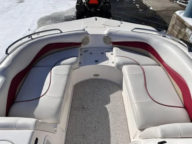 Slide: The Image of 2005 Hurricane FUNDECK202 boat interior with white and red seating, carpeted floor, and speakers. - 17