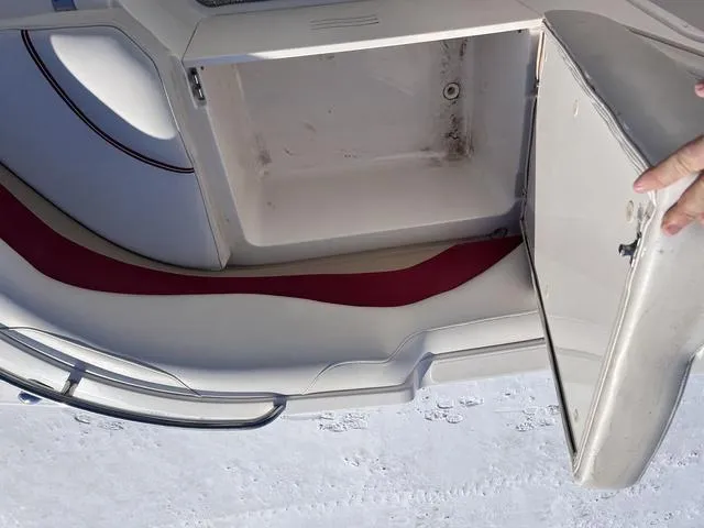 Slide: The Image of Open storage compartment on a 2005 Hurricane FUNDECK202 boat, showing interior space. - 18