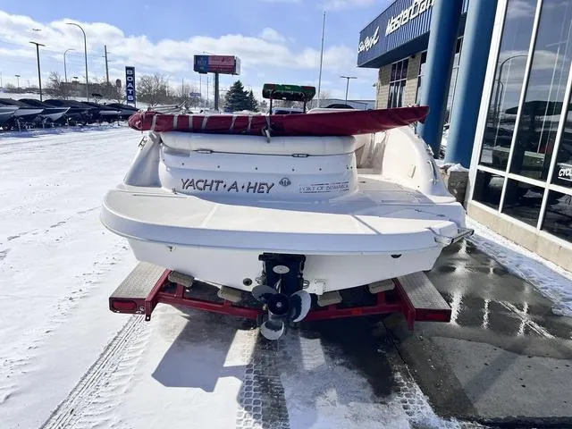 Slide: The Image of 2005 Hurricane FUNDECK202 boat on trailer in snowy dealership lot. - 2