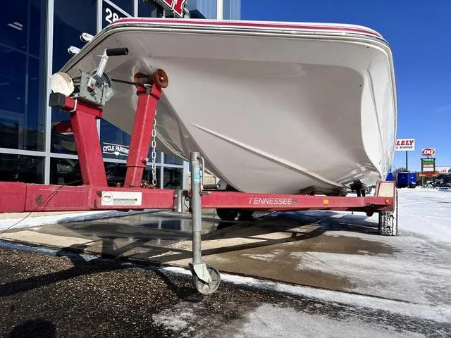 Slide: The Image of 2005 Hurricane FUNDECK202 boat on a red Tennessee trailer, parked on a snowy lot. - 3