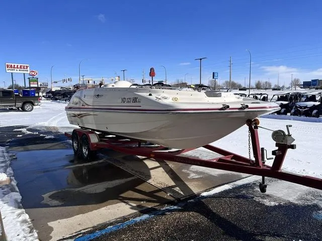 Slide: The Image of 2005 Hurricane FUNDECK202 boat on trailer in snowy parking lot. - 4