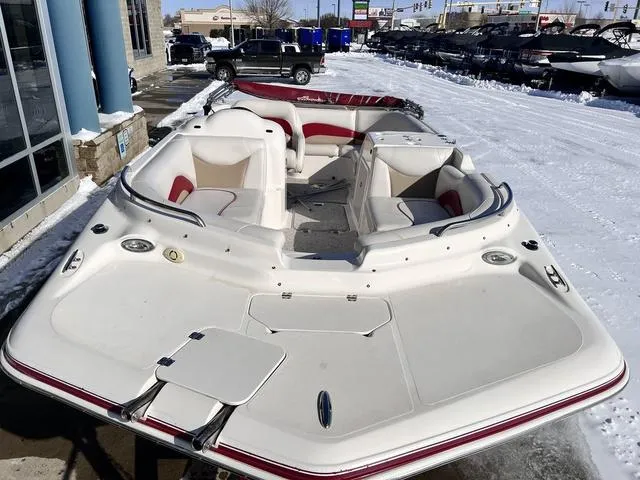 Slide: The Image of 2005 Hurricane FUNDECK202 boat in snowy outdoor setting, showcasing spacious seating and sleek design. - 5